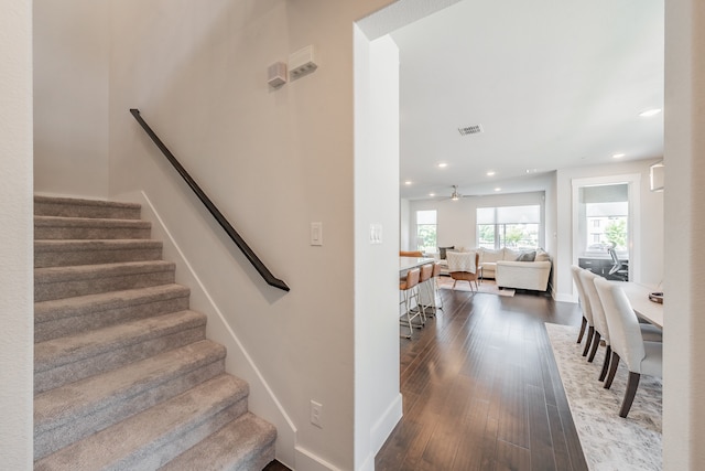 stairs featuring hardwood / wood-style flooring