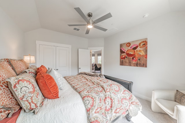 carpeted bedroom featuring ceiling fan, a closet, and lofted ceiling