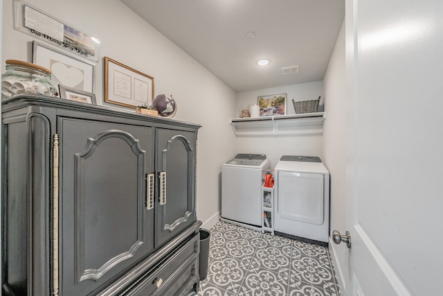 washroom with tile patterned flooring and washing machine and dryer