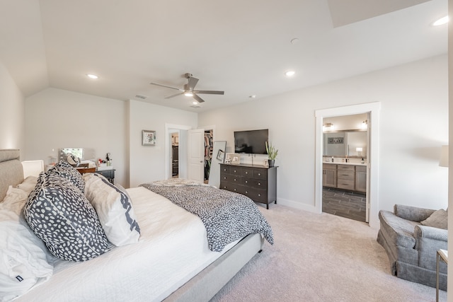 tiled bedroom featuring ceiling fan, a walk in closet, a closet, and ensuite bathroom