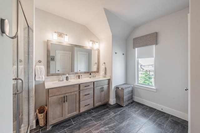 bathroom featuring a shower with shower door, tile patterned floors, vanity, and lofted ceiling