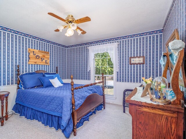 bedroom with ceiling fan and carpet floors