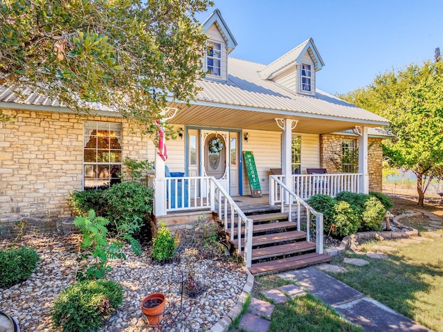 view of front of house with covered porch and metal roof