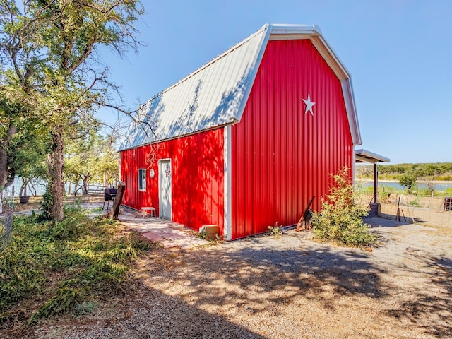 view of barn featuring a water view