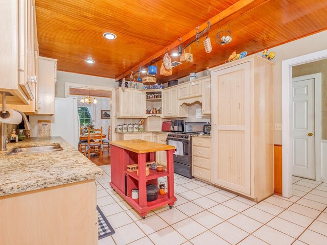 kitchen with range with two ovens, light tile patterned floors, wood ceiling, white fridge, and wooden counters