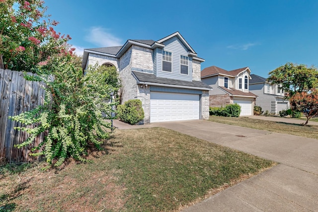 view of front facade featuring a garage and a front yard