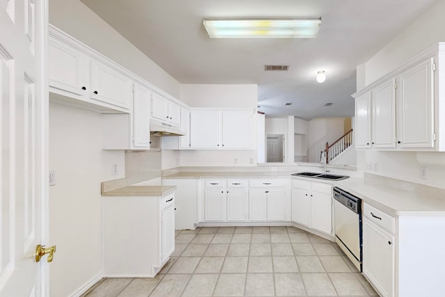 kitchen with custom range hood, white cabinetry, dishwasher, light tile patterned floors, and sink