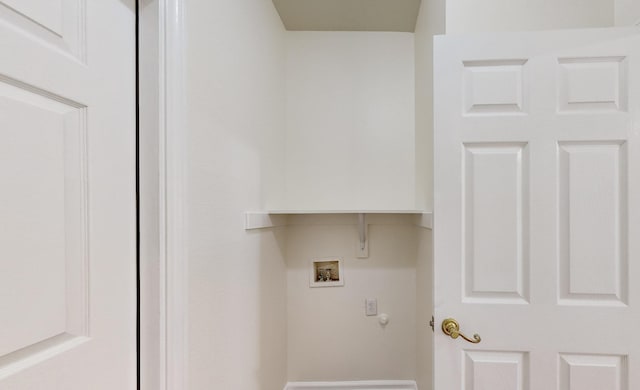 clothes washing area with washer hookup and hookup for a gas dryer