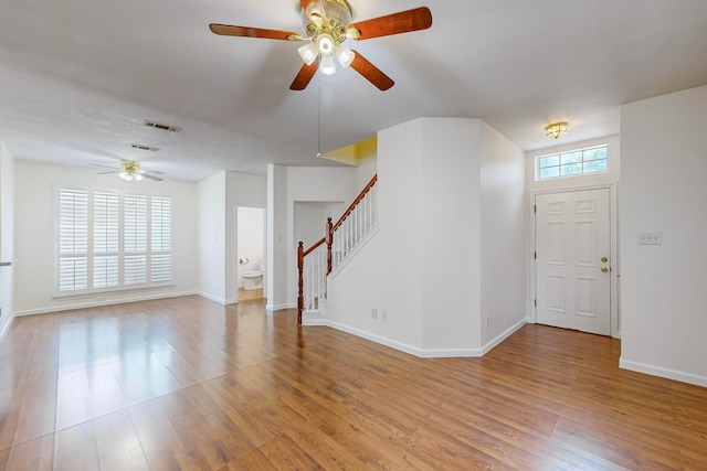 entrance foyer featuring ceiling fan and light wood-type flooring