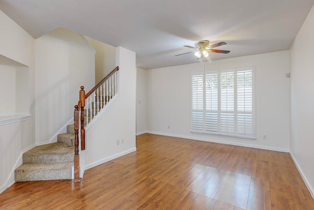 unfurnished room featuring ceiling fan and hardwood / wood-style floors