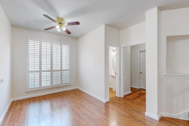 unfurnished room with ceiling fan and hardwood / wood-style floors