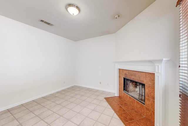 unfurnished living room featuring a fireplace and tile patterned floors