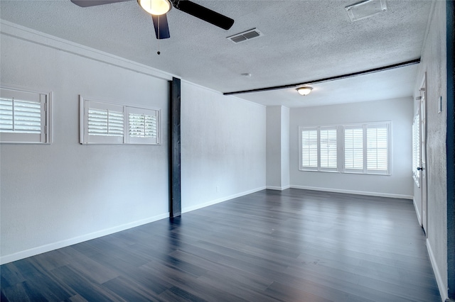 spare room with a textured ceiling, ceiling fan, and hardwood / wood-style floors