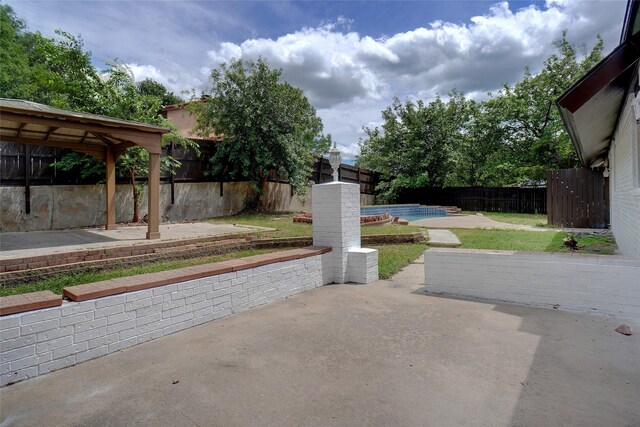 view of patio with a gazebo and a fenced in pool