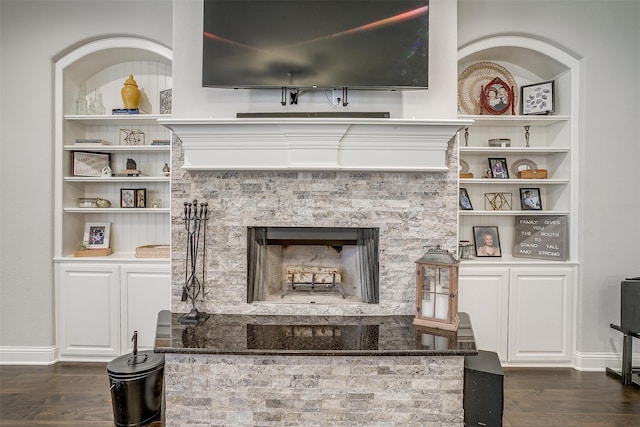 details with a fireplace and wood-type flooring