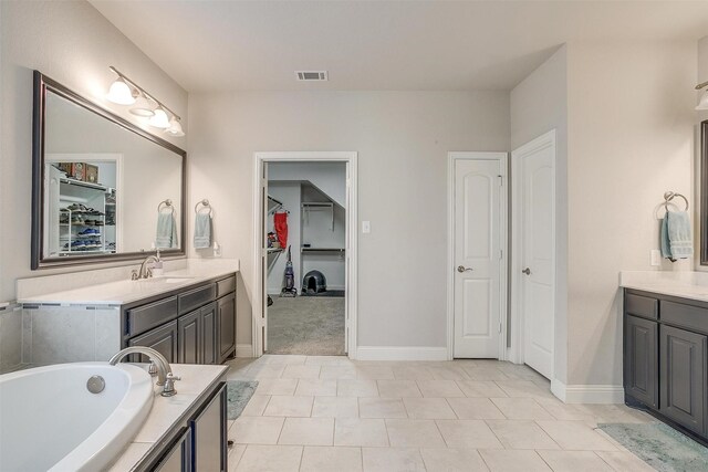 kitchen featuring white cabinets, decorative backsplash, light stone countertops, and pendant lighting