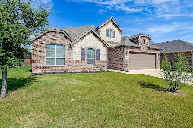 french country inspired facade featuring a garage and a front lawn