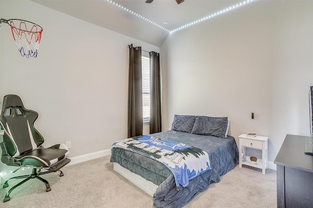 bedroom with ceiling fan, light colored carpet, and lofted ceiling