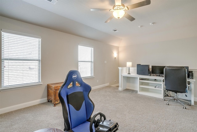 workout area featuring ceiling fan and light carpet