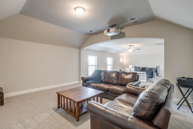 living room featuring light colored carpet, lofted ceiling, and ceiling fan