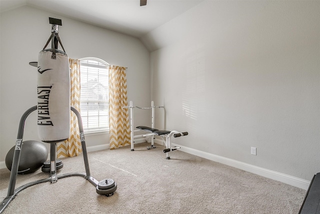 exercise area with light colored carpet and lofted ceiling