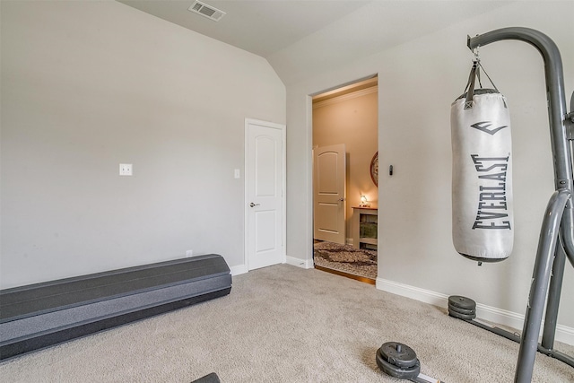 exercise room with carpet flooring and lofted ceiling