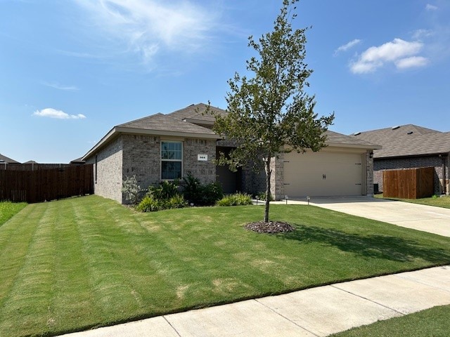 ranch-style home featuring a garage and a front yard