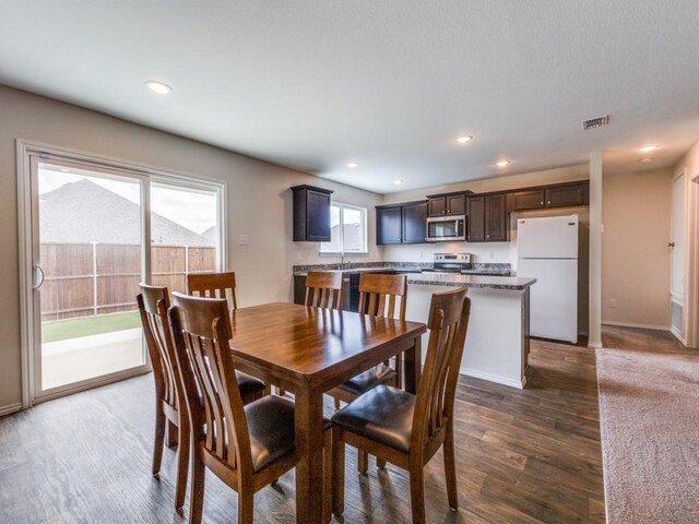 dining area featuring dark hardwood / wood-style flooring