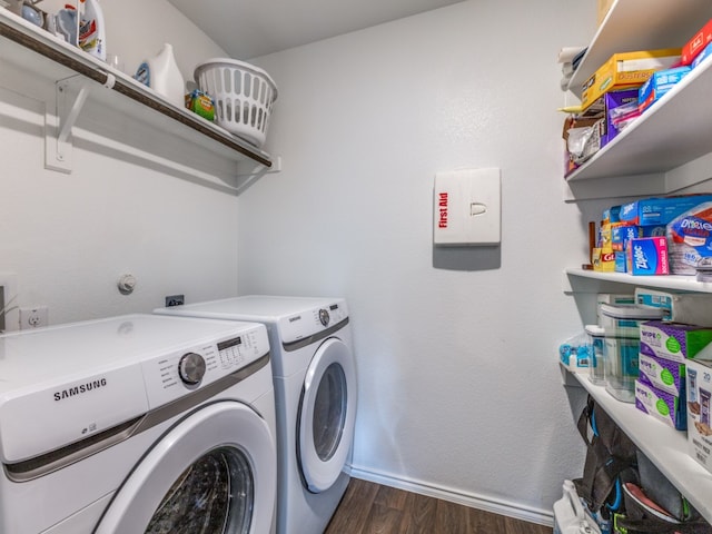 laundry area featuring dark wood-type flooring and washing machine and dryer