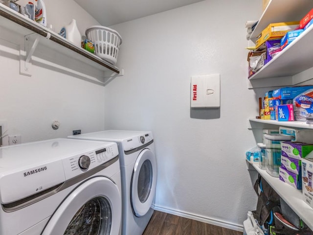 washroom with laundry area, dark wood-type flooring, independent washer and dryer, and baseboards