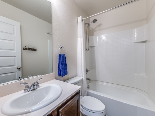 full bathroom featuring toilet, shower / bathtub combination with curtain, and vanity