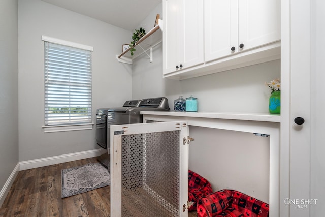 washroom with washer and dryer, cabinet space, dark wood finished floors, and baseboards