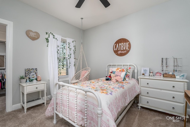 bedroom with a ceiling fan, light colored carpet, and baseboards