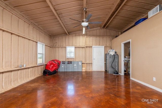 interior space featuring metal wall and a ceiling fan