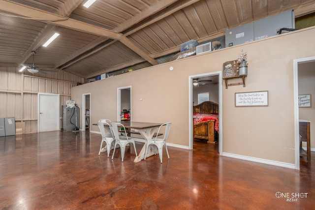 dining area featuring visible vents, finished concrete floors, ceiling fan, high vaulted ceiling, and baseboards