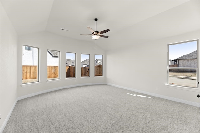 unfurnished room featuring carpet floors, ceiling fan, and lofted ceiling