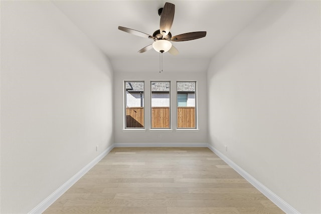 unfurnished room with light wood-type flooring, ceiling fan, and lofted ceiling