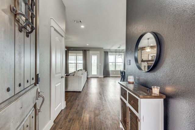 foyer entrance featuring ceiling fan and dark hardwood / wood-style flooring