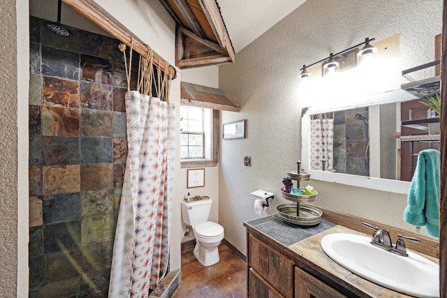 bathroom featuring tile patterned flooring, toilet, walk in shower, and vanity