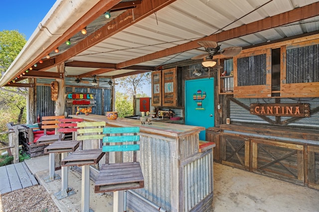 view of patio featuring an outdoor bar