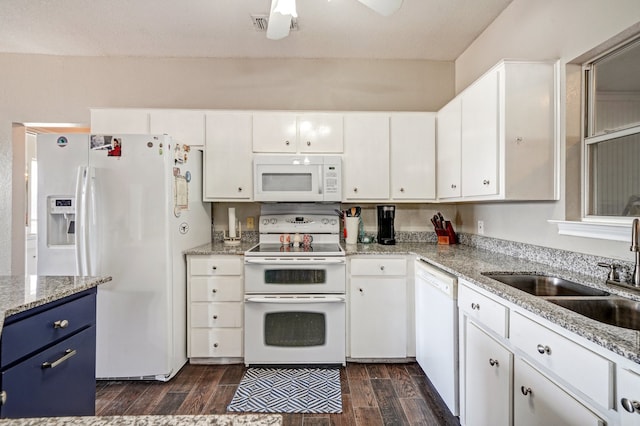 kitchen featuring sink, dark hardwood / wood-style flooring, white cabinetry, white appliances, and ceiling fan