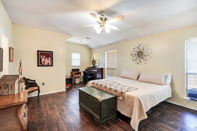 bedroom with multiple windows, hardwood / wood-style floors, and ceiling fan