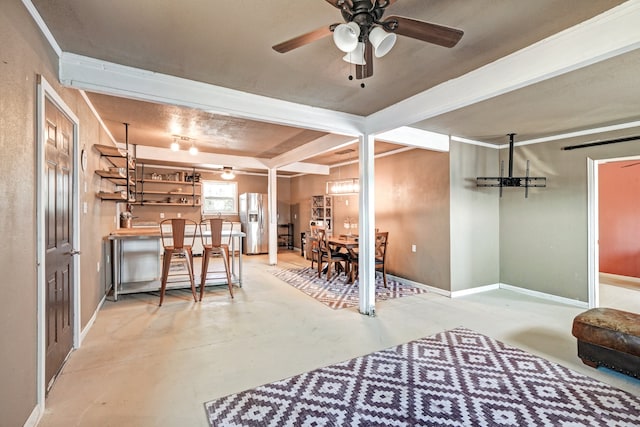 interior space with ceiling fan and stainless steel refrigerator with ice dispenser