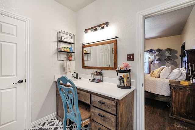 bathroom with hardwood / wood-style floors and vanity