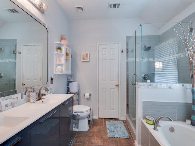 full bathroom with toilet, tile patterned flooring, vanity, vaulted ceiling, and shower with separate bathtub