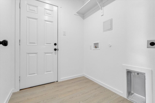 washroom featuring light hardwood / wood-style floors, electric dryer hookup, washer hookup, and gas dryer hookup