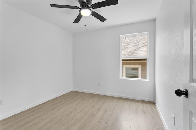 empty room with ceiling fan and light wood-type flooring