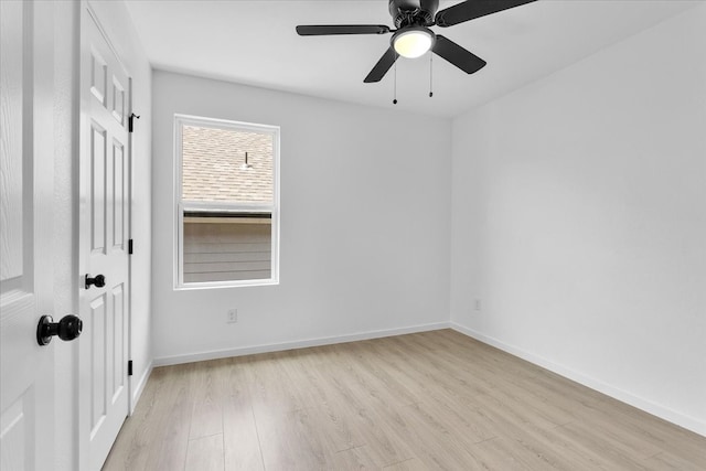 spare room featuring light wood-type flooring and ceiling fan