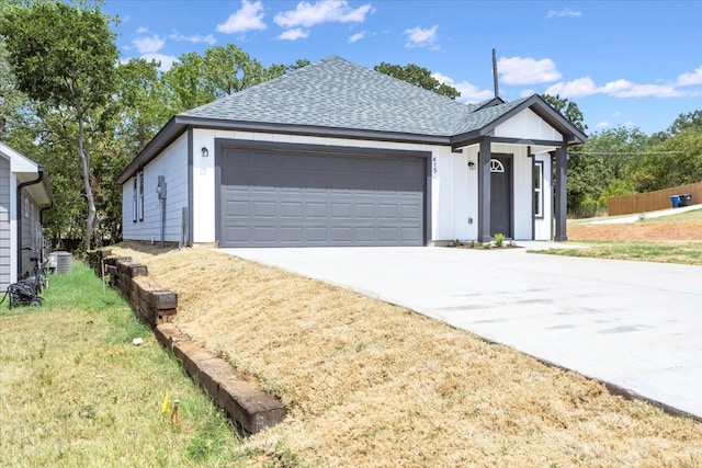 ranch-style home with central AC unit and a front lawn