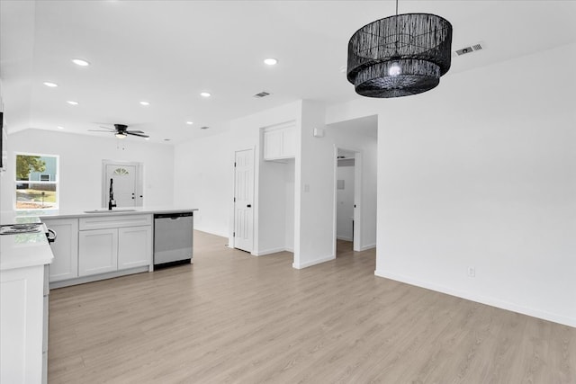 kitchen featuring sink, white cabinetry, light hardwood / wood-style flooring, dishwasher, and ceiling fan